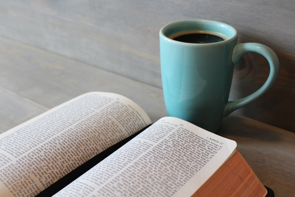 open Bible and coffee cup